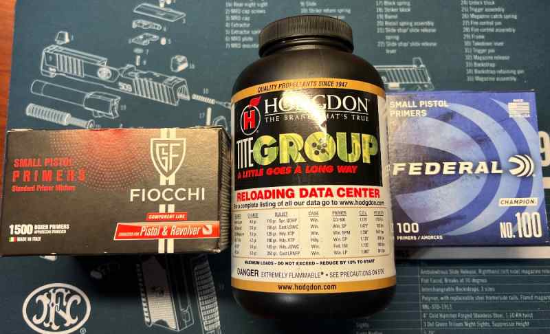 Small pistol primers with powder
