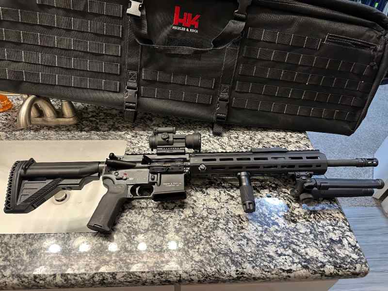 HK mr556 A1 New with aim point pro 